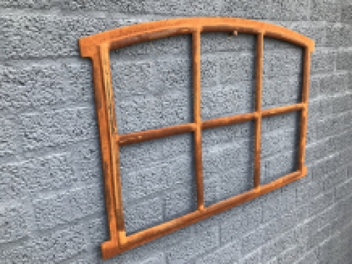 Cast iron window fitted with arches, stable window.